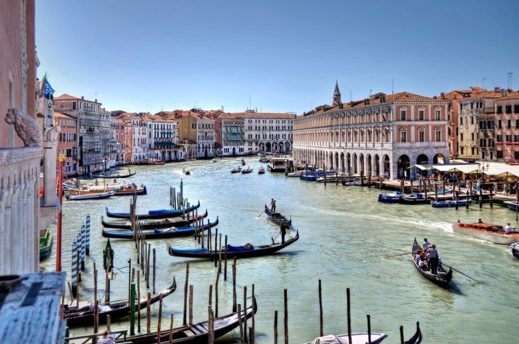 Glide along the iconic Grand Canal, Venice's mesmerizing waterway, lined with opulent palazzi, charming bridges, and the vibrant pulse of Venetian life.

